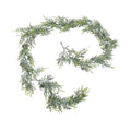 Frosted green artificial pine garland arranged in a loose spiral on white, with pinecones spaced among the branches.