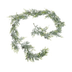 Frosted green artificial pine garland arranged in a loose spiral on white, with pinecones spaced among the branches.