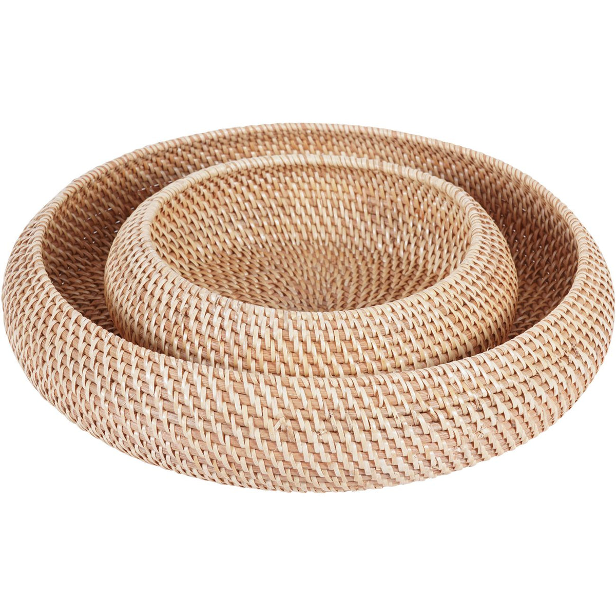 Smaller basket nested inside the larger basket, viewed at an angle showing their rounded sides and bound rims.
