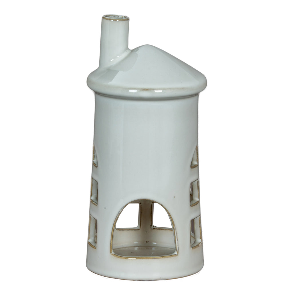 Rear view of the white lighthouse holder showing the large arched opening and hollow interior, with windows visible along either side.
