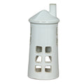 Front view of a white lighthouse tea light holder with rows of square windows, a conical roof and an offset chimney.