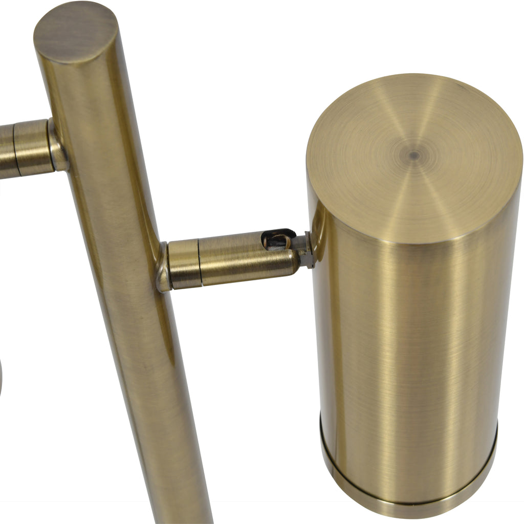 Close-up from above of a cylindrical spotlight and the joint connecting its short arm to the lamp's upright stand.