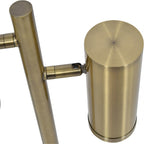Close-up from above of a cylindrical spotlight and the joint connecting its short arm to the lamp's upright stand.