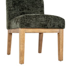 Low front angle of the chair showing the thick olive seat, brown rails and four legs with small dark foot pads.