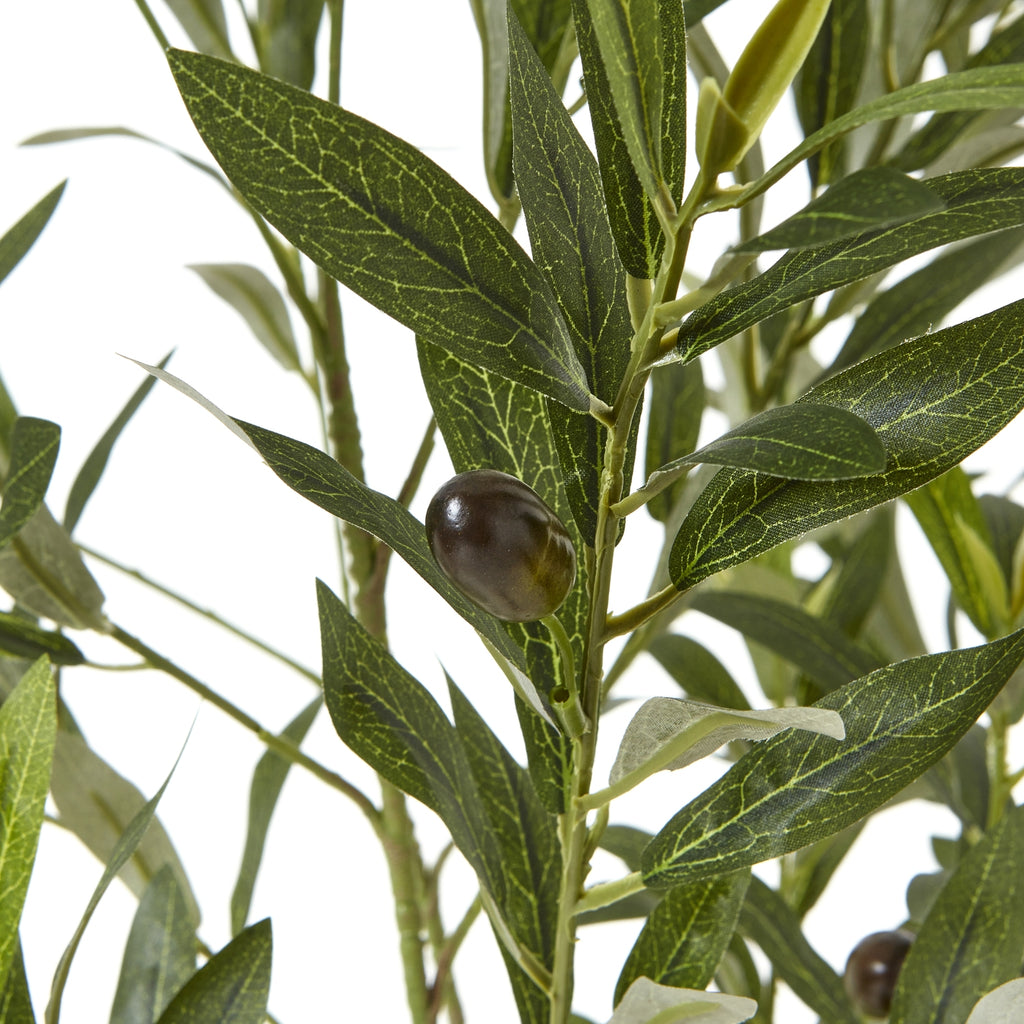 Close-up of a dark olive-like fruit among pointed green artificial leaves with pale vein patterns and lighter undersides.