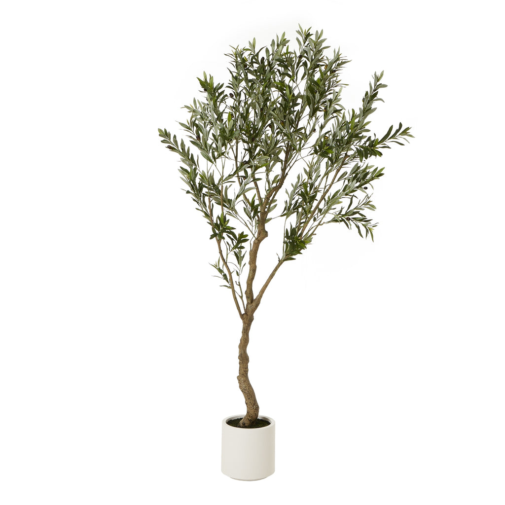 Full view of an artificial tree with a curved brown trunk, branching green crown and white cylindrical pot against a white background.