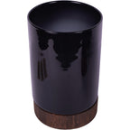 Elevated view of the black glass hurricane vase showing its wide opening and wooden base.