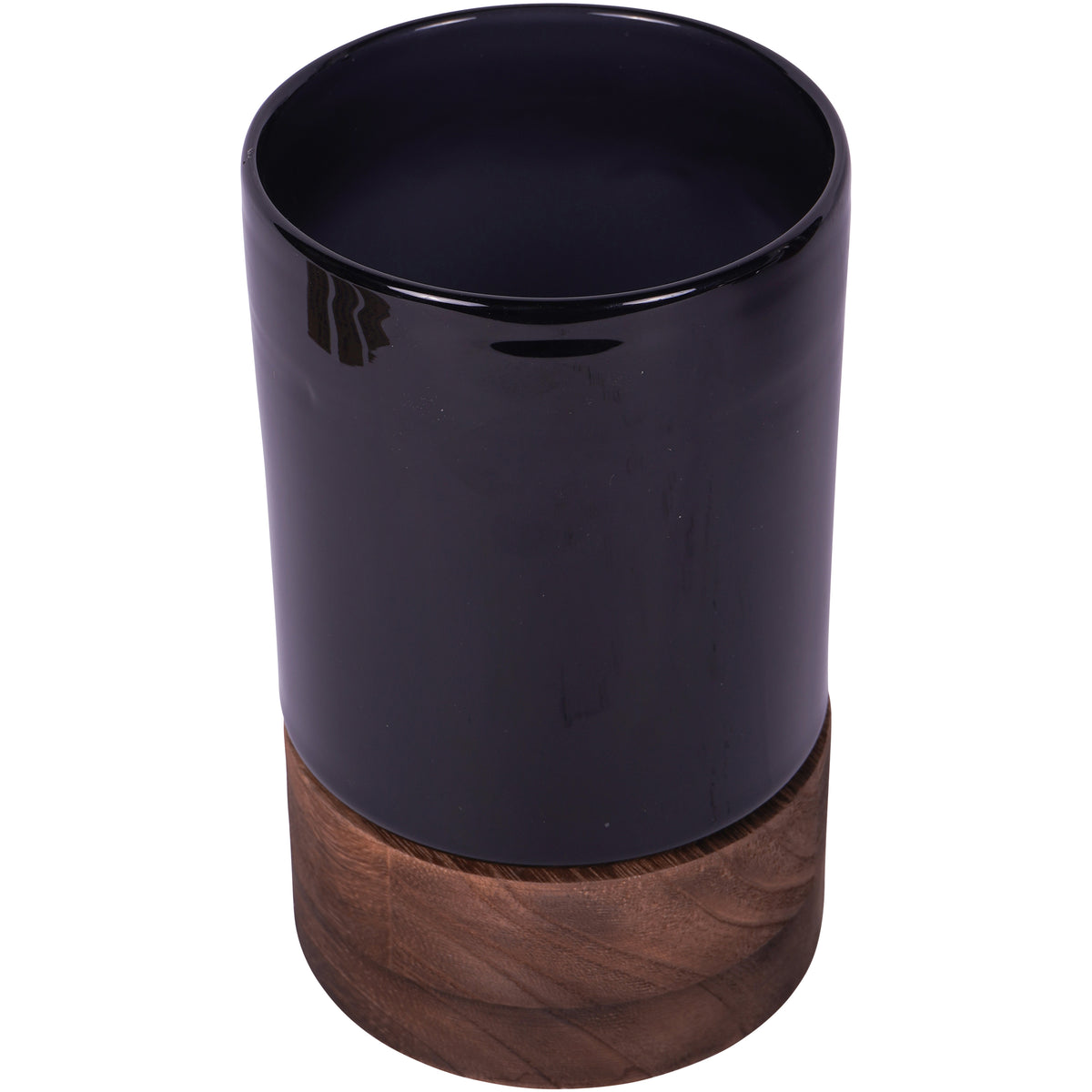 Elevated view of the black glass vessel showing its open top and round wooden base.