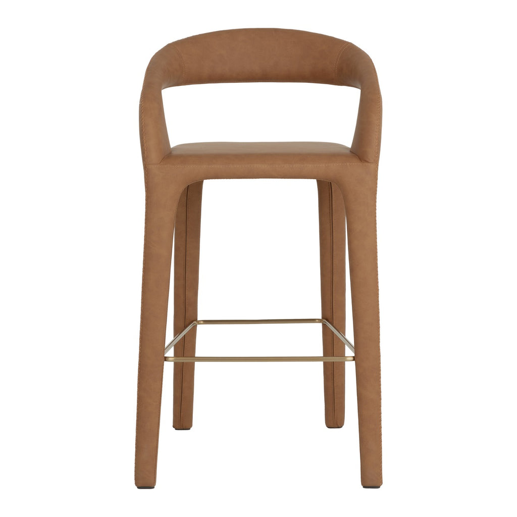 Front view of the Cognac brown bar stool showing the broad opening above the seat, stitched upholstery and gold-toned rectangular foot rails.