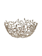 Side view of the open branch bowl showing its curved base and uneven leafy rim against white.