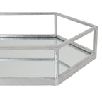 Close view of a tray corner where silver-toned rails meet above reflective side panels, with fine surface variation visible along the frame.