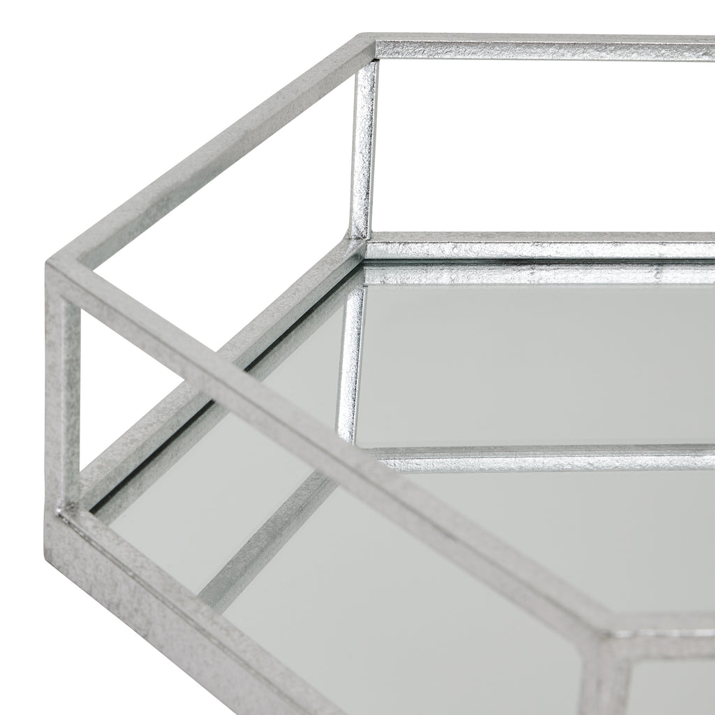 Angled detail of the tray's open upper rail and reflective base, showing the hexagonal corner and reflections of the silver-toned frame.