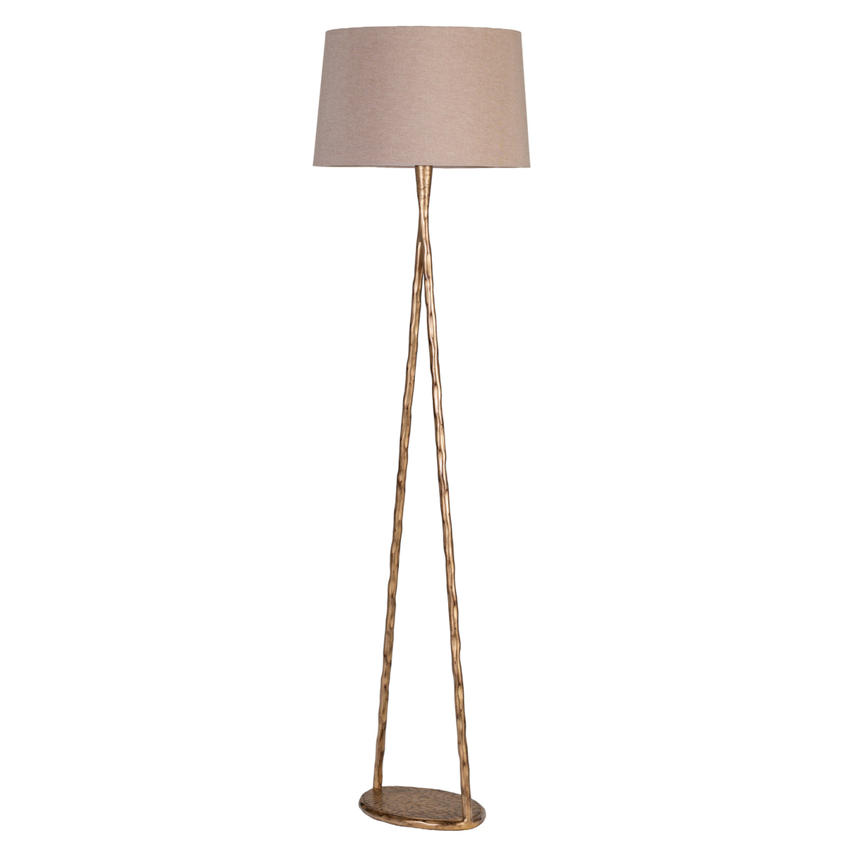 Angled side view of the floor lamp, showing the slim open gold frame, circular base and broad fabric shade.