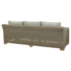 Rear angled view of the sofa showing the grey weave pattern across its rounded back, pale cushions above and short feet below.