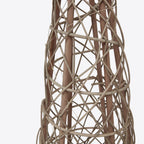 Detail of irregular crossing strands, broader upright lines and fine light wire on the brown tree decoration.