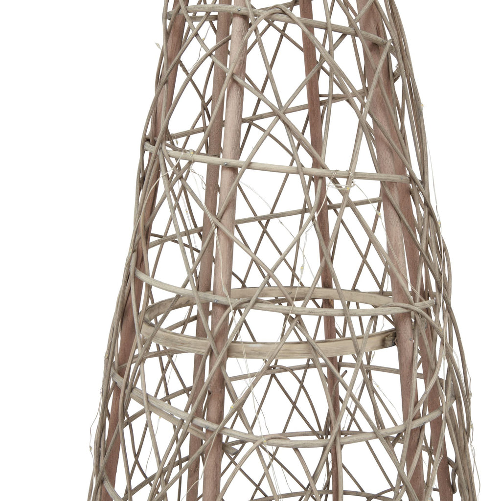 Detail of the tree body showing pale crossing strands, brown upright pieces and fine light wire within the open weave.