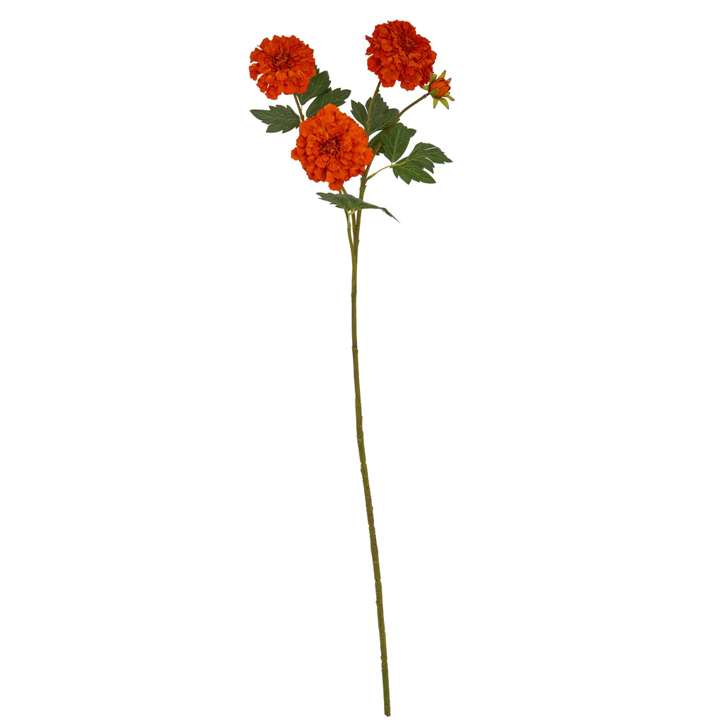 Full view of an orange artificial flower spray with three open blooms, a small bud, dark green leaves and a long green-brown stem.
