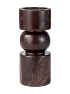 Red and burgundy marble candle holder with a rounded centre between a cylindrical top and base, shown against white.