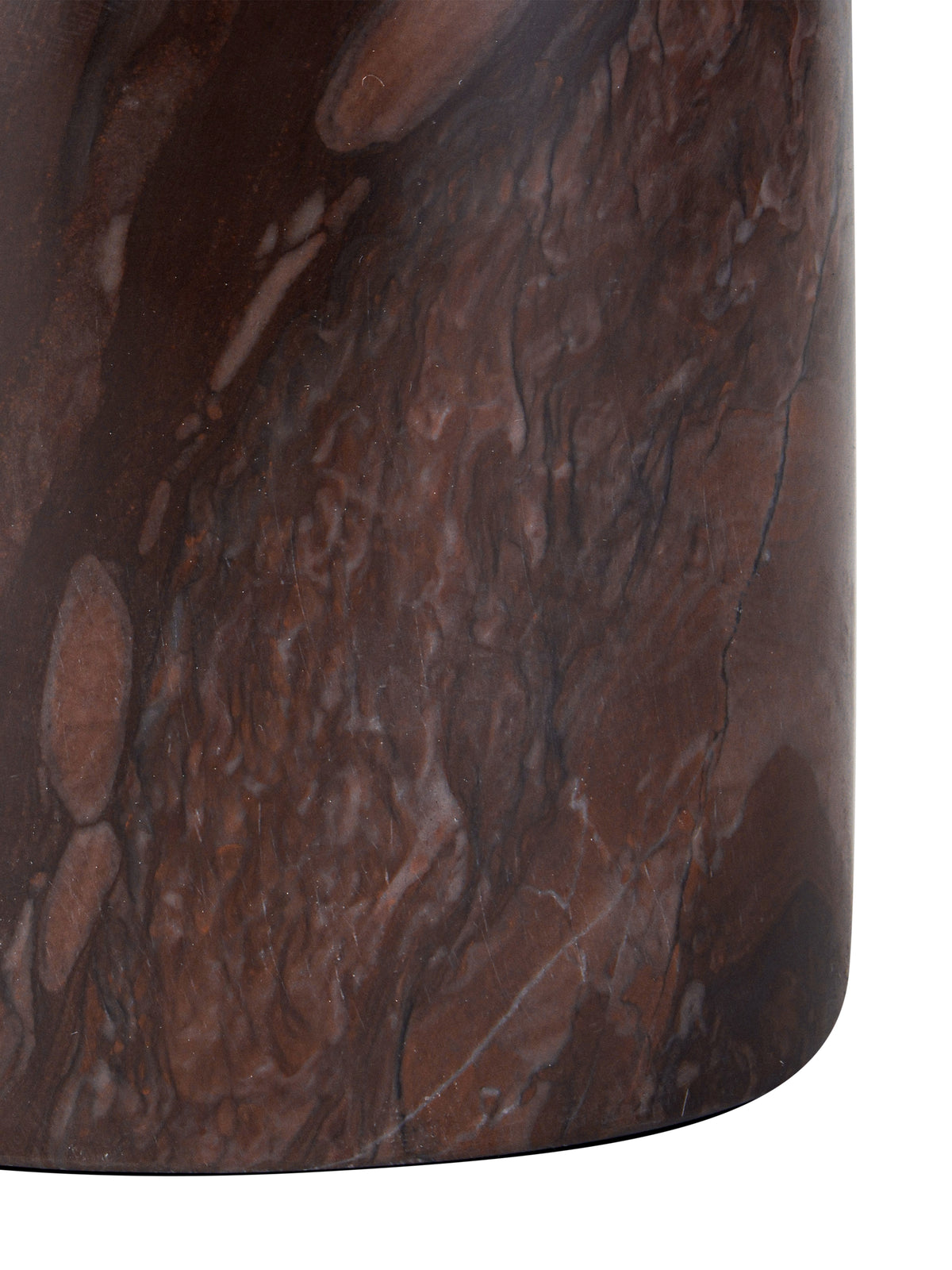 Close-up of the candle holder's cylindrical marble base, showing mottled red markings and fine pale and dark veins.