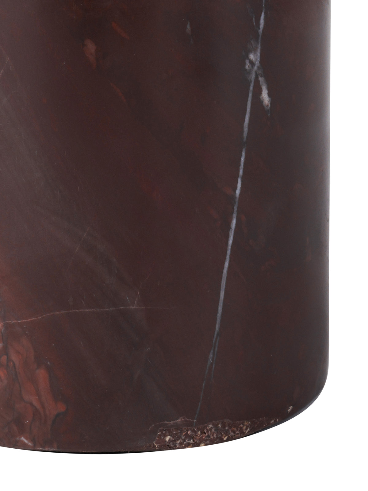 Close-up of the cylindrical marble base, showing chocolate and red tones, fine pale veins and its curved lower edge.