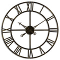 Front view of an open circular wall clock with dark brass-toned rings, Roman-numeral bars, four straight spokes and ornate hands against white.
