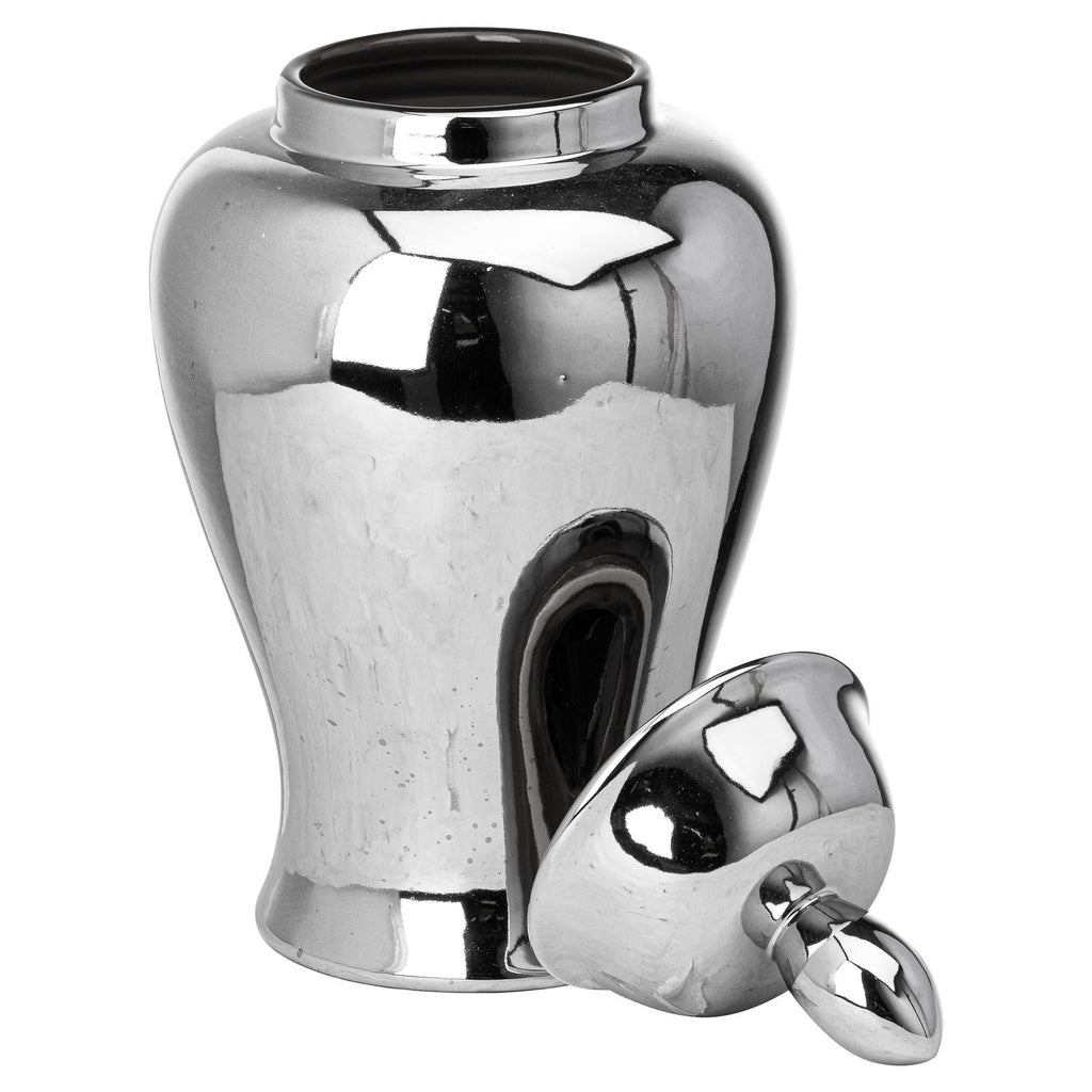 Reflective silver-coloured ginger jar with its opening visible and the domed lid resting at an angle beside the base, oval finial pointing downwards.