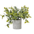 Artificial plant with spreading yellow-green and dark green oval leaves in a mottled grey cylindrical pot, against a white background.