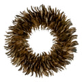 Full view of a circular decorative wreath with an open centre and overlapping brown, tan and olive feather-like forms on a white background.
