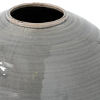 Close-up of the vase's low circular rim and curved shoulder, showing fine crackle in the glossy grey glaze and dark patches along the rim.