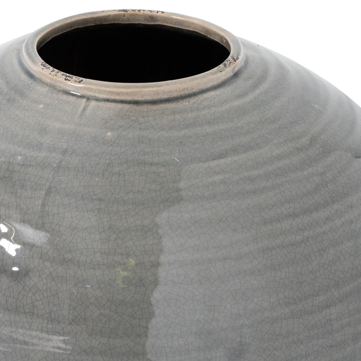 Close-up of the vase's low circular rim and curved shoulder, showing fine crackle in the glossy grey glaze and dark patches along the rim.