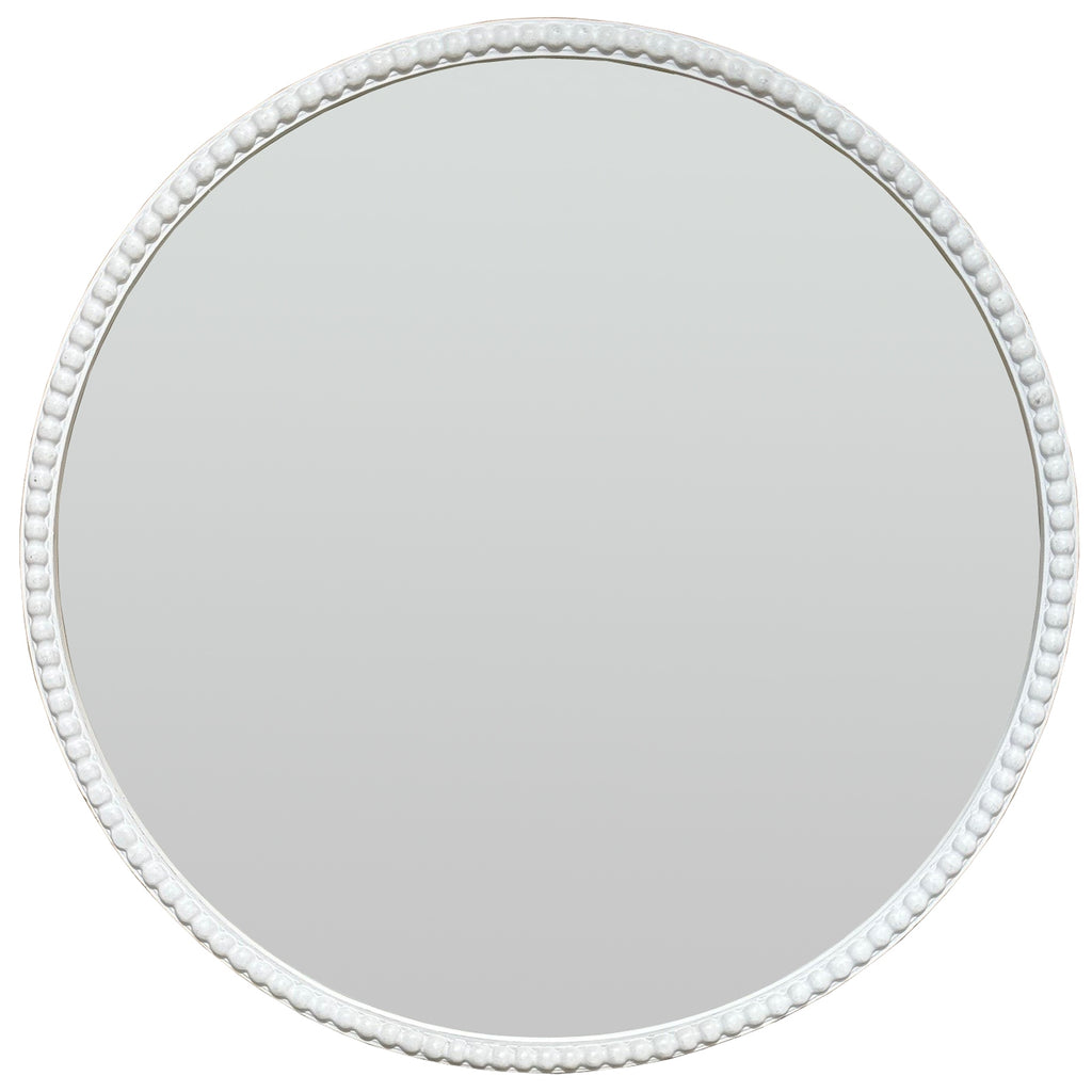 Front view of a round mirror with a narrow pale border of raised beads.