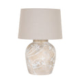 Pale Branch Table Lamp on a white background, with a rounded mottled taupe base, pale leafy branch motifs and a broad beige tapered shade.
