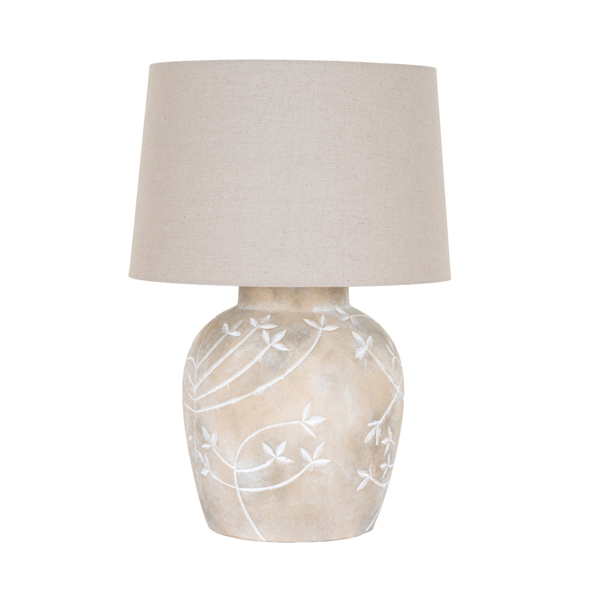 Pale Branch Table Lamp on a white background, with a rounded mottled taupe base, pale leafy branch motifs and a broad beige tapered shade.