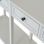 Close-up of a pale framed drawer front and dark round knob, with the console top, straight uprights and lower shelf visible.