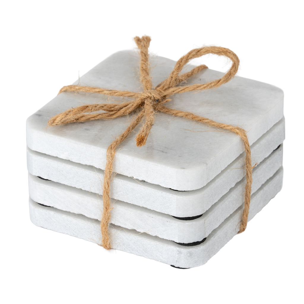 Four pale square coasters stacked and tied with brown twine, showing rounded corners, rough edges and small black underside pads.