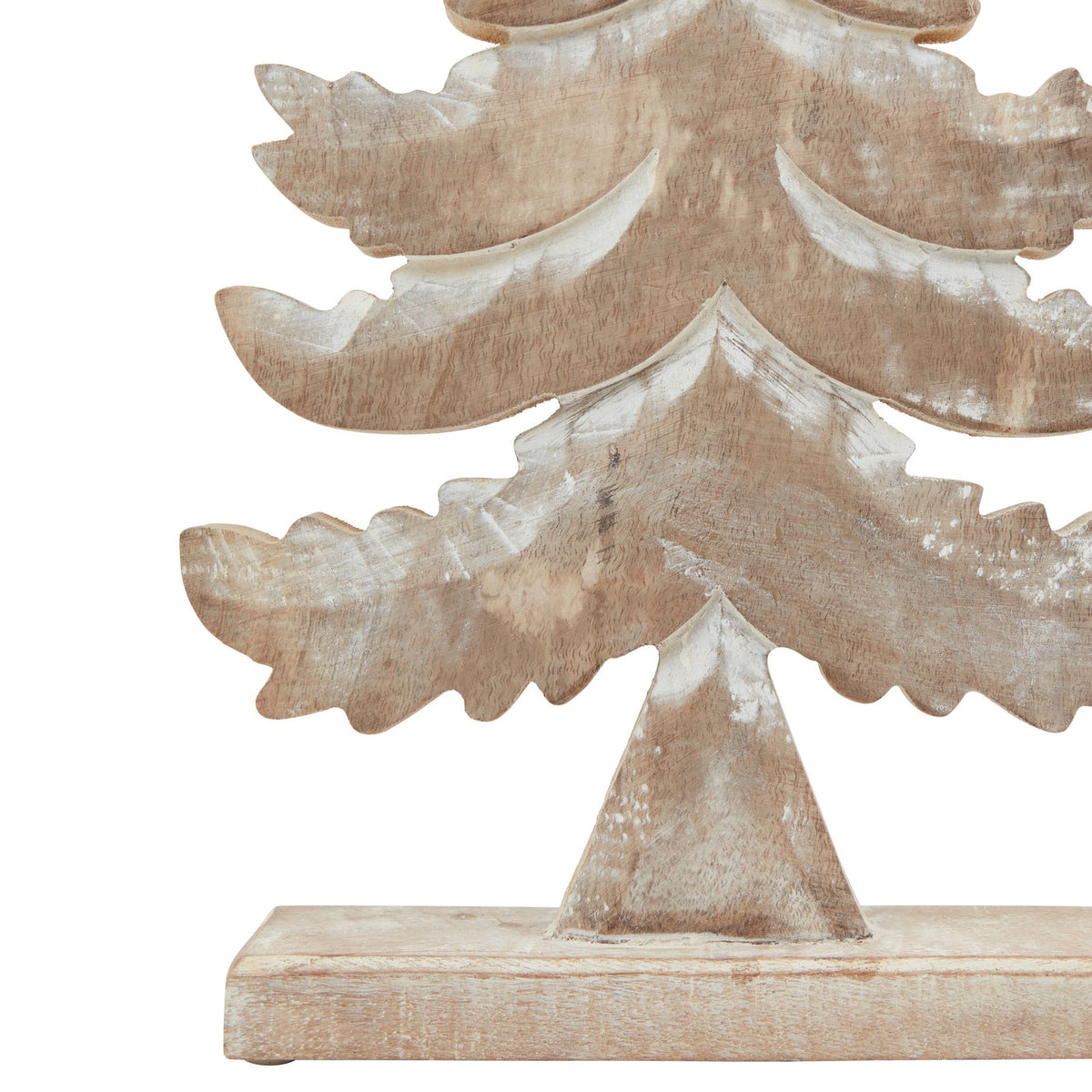 Close-up of the tree's broad lower branches, tapered trunk and rectangular base with pale white surface accents.