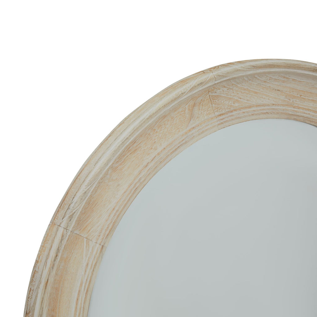 Close-up of the mirror's curved frame showing grain-like lines, segmented joins and moulded inner and outer edges.