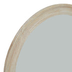 Close-up of the mirror's curved frame showing cream grain-like markings, tan tones, segment joints and shallow moulded edges.