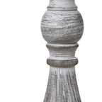 Close-up of the lamp column's rounded section and narrow collars, showing pale streaks over the grey-brown surface.