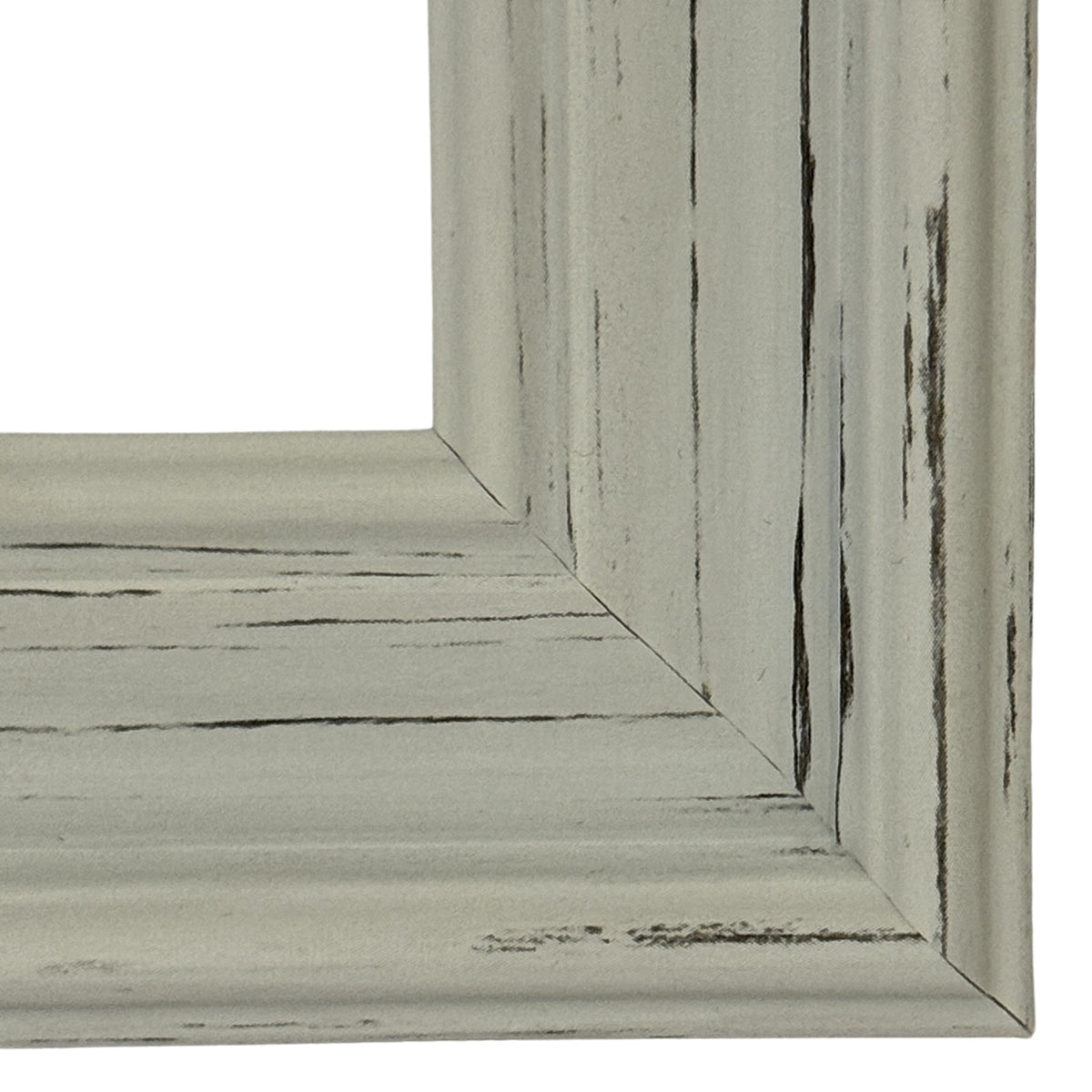 Close-up of the frame's lower right corner, where pale stepped moulding meets diagonally and dark rubbed streaks cross the ridges.