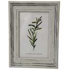 Front view of a pale grey-white portrait frame with stepped moulding, dark rubbed lines and a leafy insert marked 4 × 6 inches.