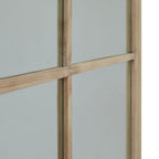 Angled detail of the slender horizontal and vertical grid bars crossing in front of the mirror, with the right frame edge visible.