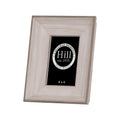 Angled front view of a portrait photo frame with a broad pale wood-effect border, darker stepped edging and a black display insert.