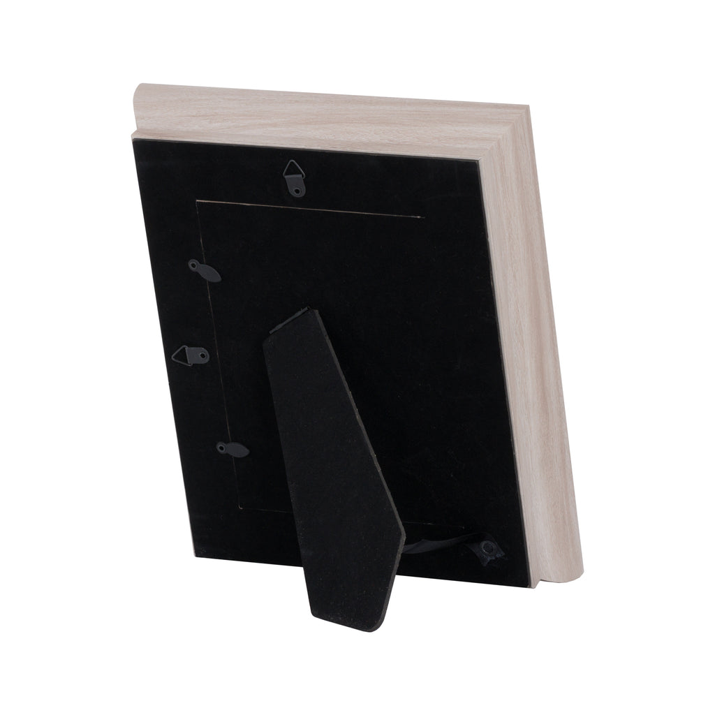 Rear view of the pale photo frame showing black backing, hanging fittings and an extended folding easel stand.