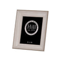 Front angled view of a portrait photo frame with broad pale wood-effect borders, slim darker edging and a black display insert.