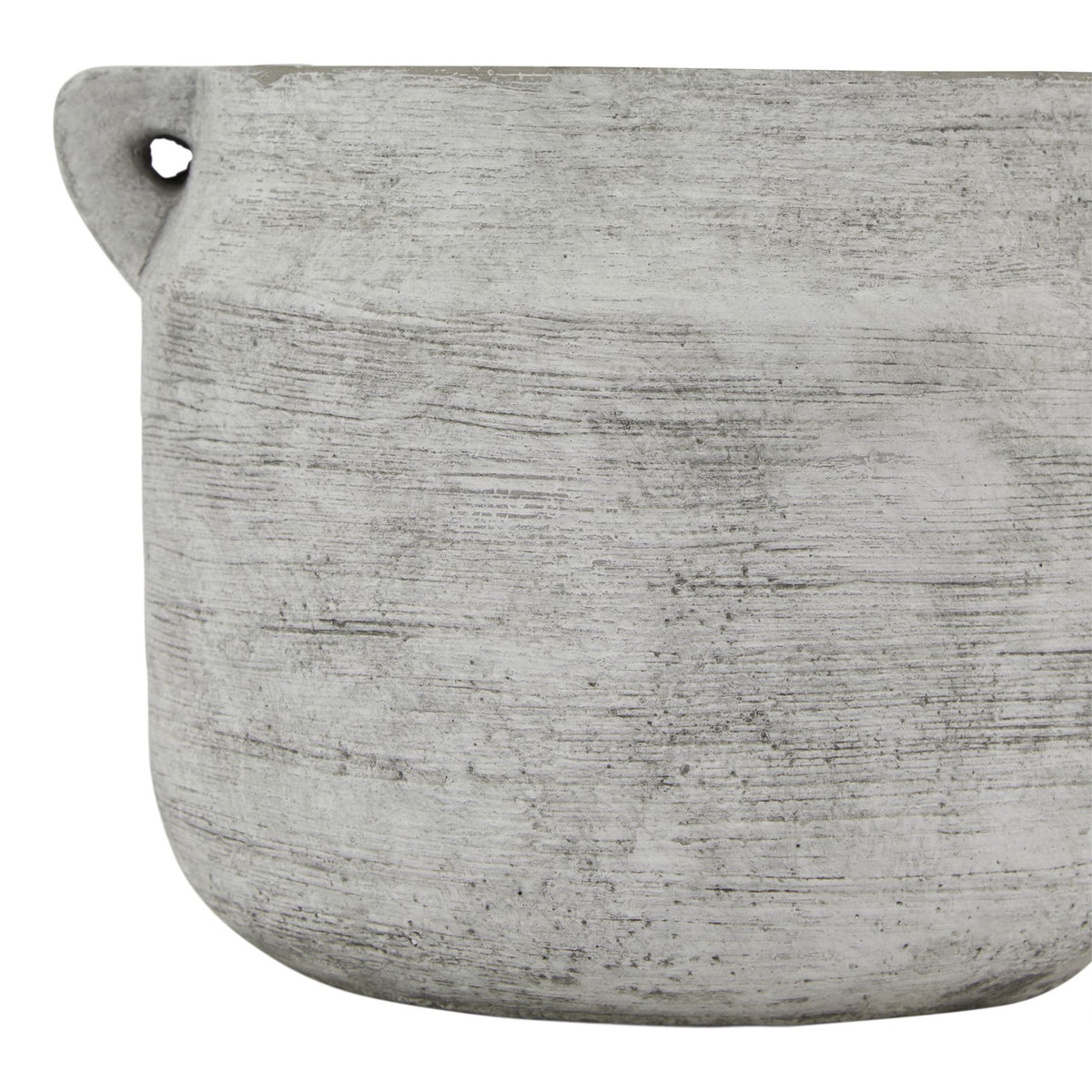 Close-up of the vase's grey-white striated surface, with a loop handle at the upper left and the curved base below.