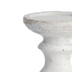 Close-up of the candle holder's shallow tray and upper stem, showing pale surface markings, small pits and darker traces around the rim.