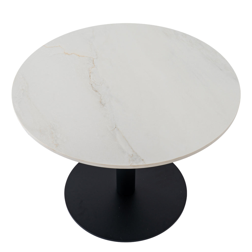 Coffee table viewed from above at an angle, showing fine warm-toned veining across the pale circular top and the dark base below.
