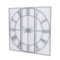 Angled view of the Panel Roman Wall Clock with three whitewashed rectangular panels, grey Roman numerals and ornate hands.