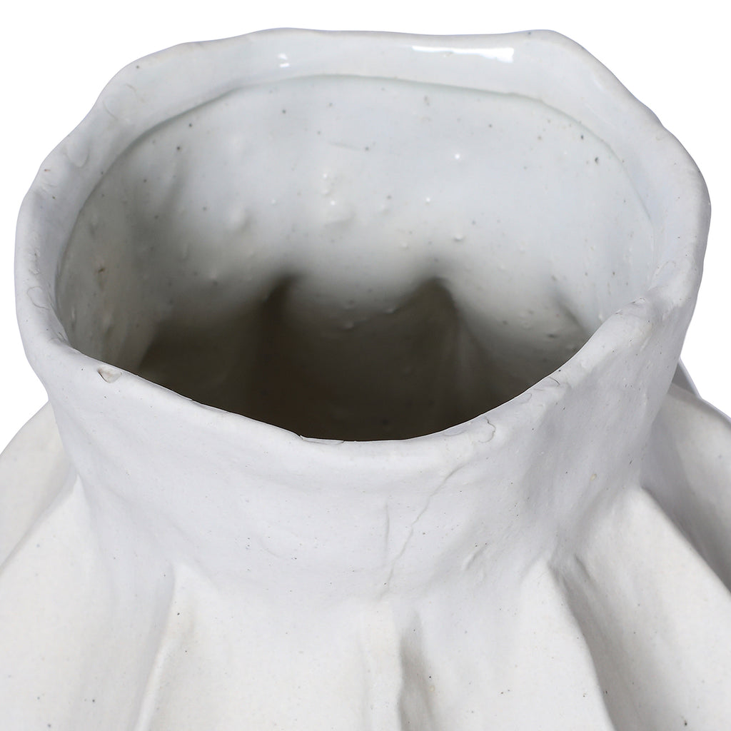 Close view into the vase opening, showing the undulating white rim and speckled ceramic interior.